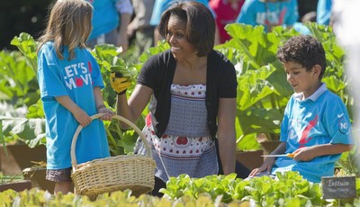 
              FILE - In this June 3, 2011, file photo, first lady Michelle Obama tends the White House garden in Washington, with a group of children as part of the "Let